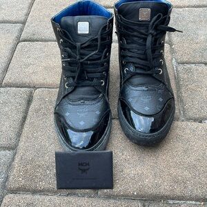High top MCM logo sneakers.